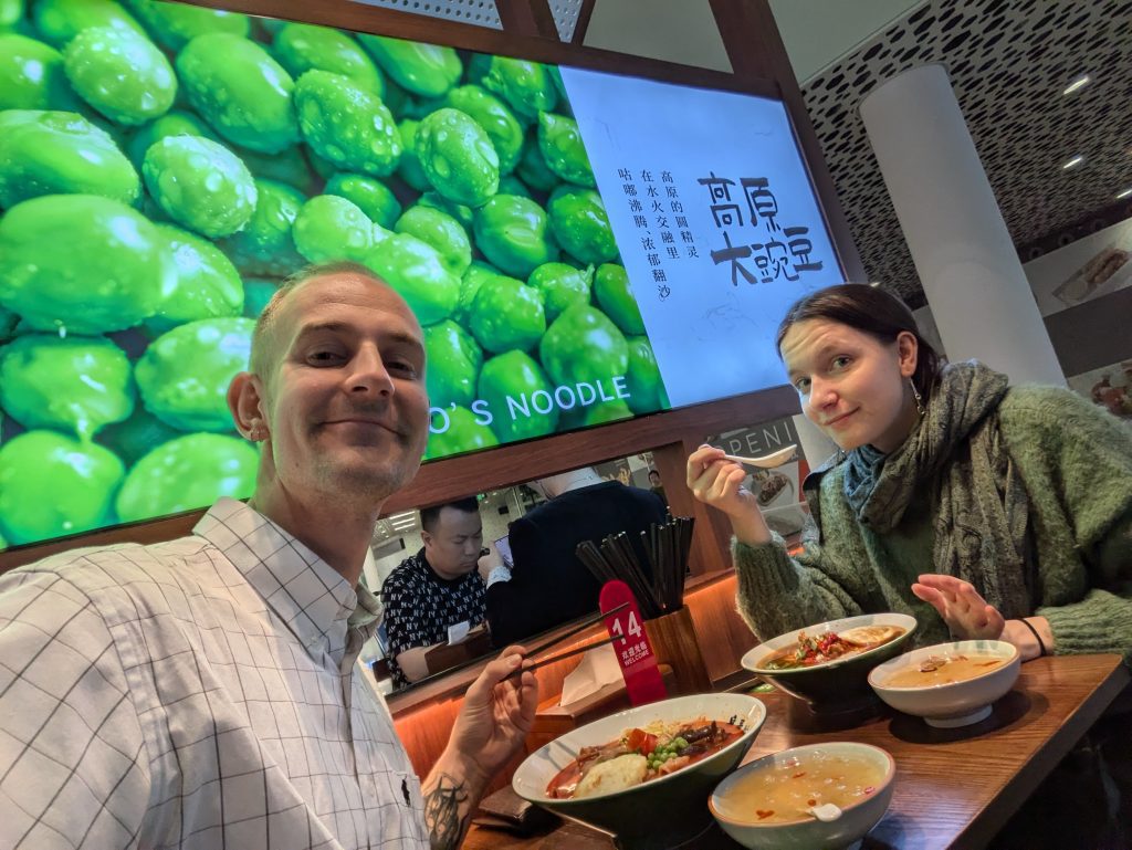 Us eating noodles in Shenzen airport 