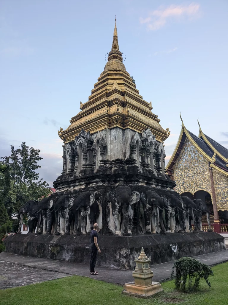 Tommas standing in front of Wat Chiang Man's Chedi