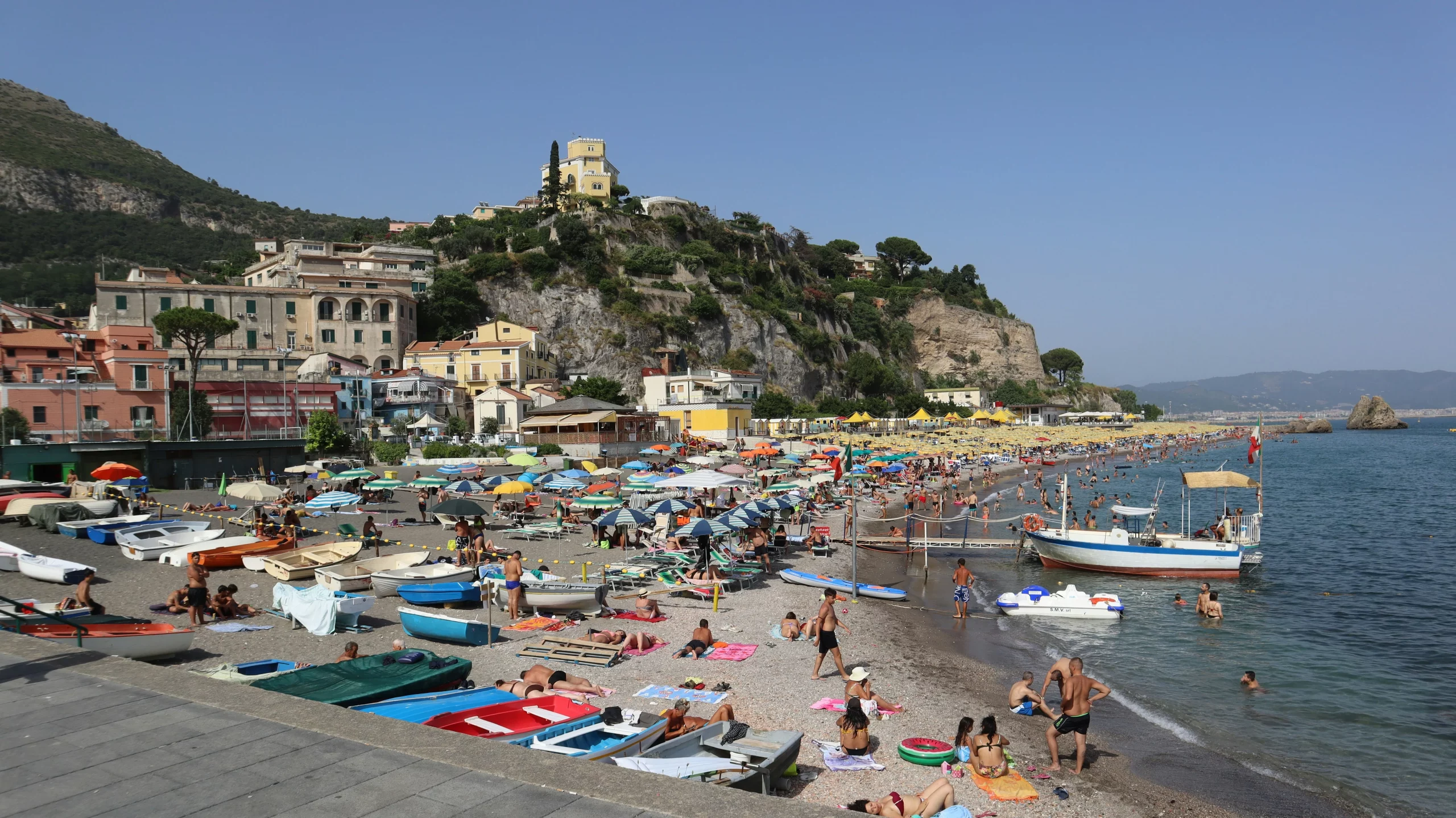A crowded beach on the Amalfi Coast during summer